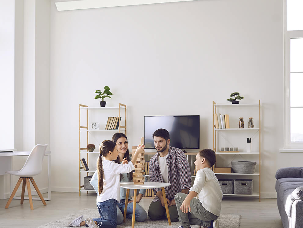 Family in living room photo.